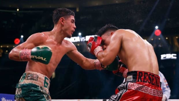 Elijah Garcia (L) trades punches with Armando Resendiz of Mexico during their middleweight fight. Elijah Garcia media workout in Phoenix. SARAH STIER. 